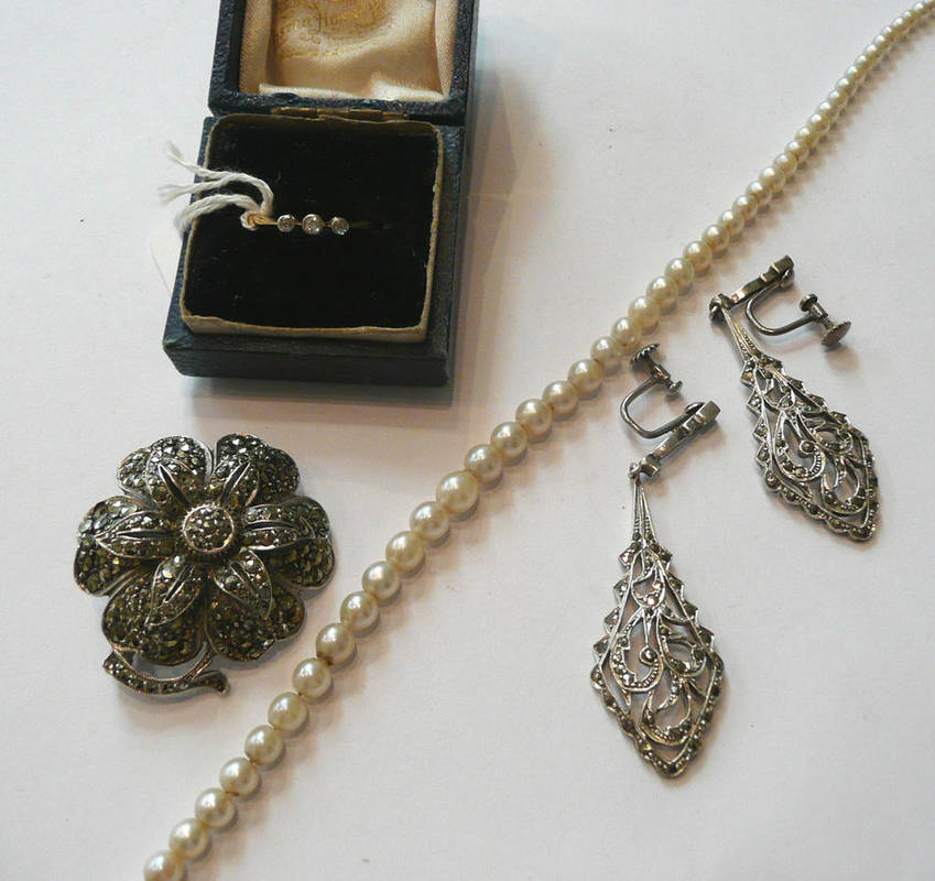 Lot 89 - A small three stone diamond ring, a strand of cultured pearls, a marcasite brooch and a pair of...