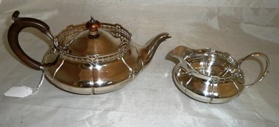 Lot 100 - A silver teapot and milk jug