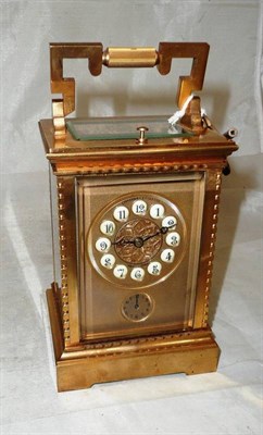 Lot 102 - Brass repeating carriage clock with enamelled dial