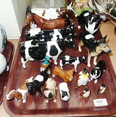 Lot 143 - Beswick Ayrshire bull, two Friesian cows and calf, seven dogs, penguins etc