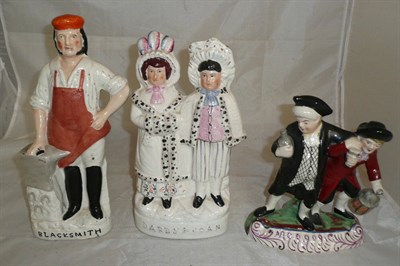 Lot 146 - Staffordshire figure group The Blacksmith and two other figural groups (3)