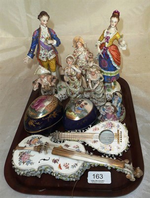 Lot 163 - Ceramics including six Continental figures, two flower encrusted musical instruments, two egg boxes