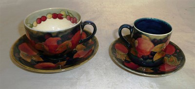 Lot 176 - A Moorcroft cup and saucer and a Moorcroft coffee cup and saucer