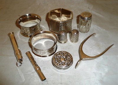 Lot 181 - Three silver napkin rings, a pair of wishbone sugar nips, two silver pencils, thimbles etc