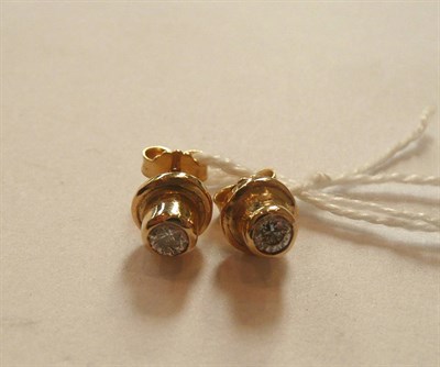 Lot 188 - A pair of 18ct gold diamond solitaire earrings