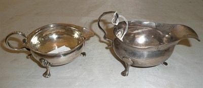 Lot 197 - Two Georgian silver cream jugs