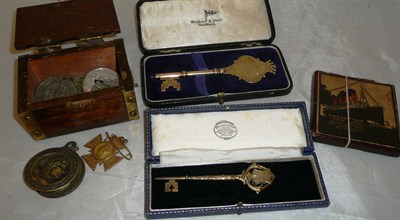 Lot 206 - A box of Lusitania commemorative medallion, two presentation silver keys a box of medallions