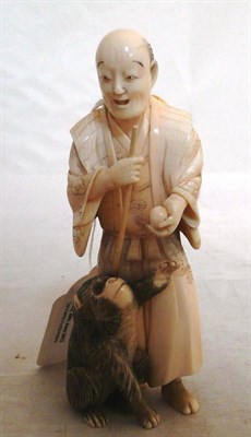 Lot 225 - A Japanese ivory figure of a man and a monkey