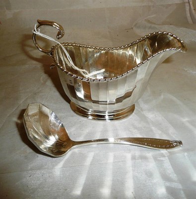 Lot 226 - A silver sauce boat and ladle