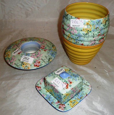 Lot 262 - A Shelley chintz vase, a butter dish and cover and a table centre (3)