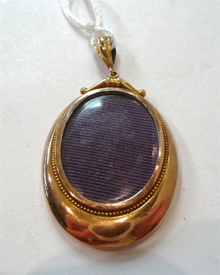 Lot 291 - A Victorian double sided locket pendant with bead decoration