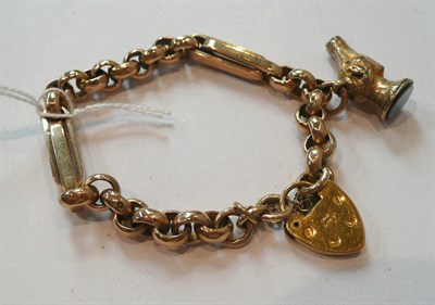 Lot 309 - A curb and lock bracelet with horse head charm