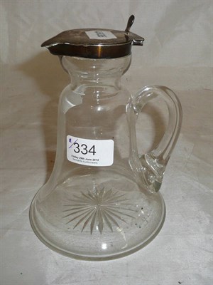 Lot 334 - Glass jug with silver top