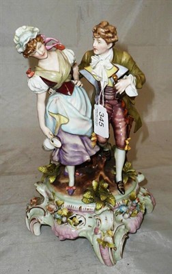 Lot 345 - A Dresden figure of lovers on a flower encrusted base