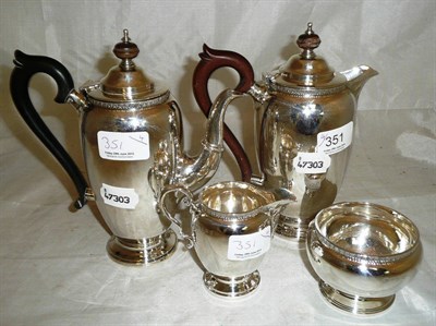 Lot 351 - A silver four piece coffee service comprising coffee pot, hot water jug, cream jug and sugar bowl