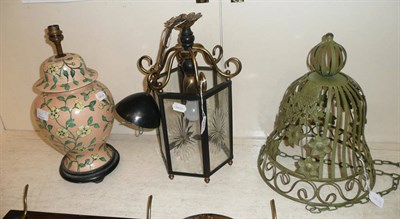 Lot 365 - Pottery table lamp and a brass mounted hall lantern, a green painted metal hanging planter (3)