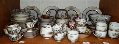 Lot 367 - An extensive Japanese porcelain tea service including a teapot, bowls, plates, etc