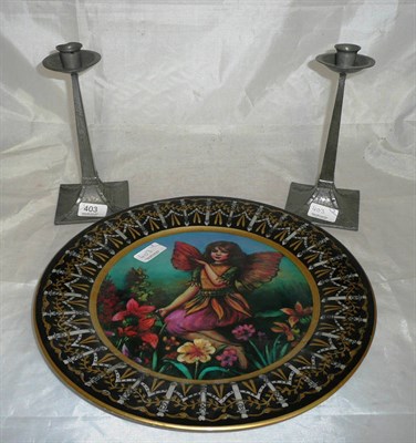 Lot 403 - A pair of pewter Arts and Crafts candlesticks and a large fairy plate