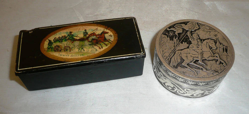 Lot 421 - A papier mache snuff box, and a silvered box of George and the dragon