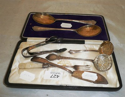 Lot 427 - Pair of silver serving spoons (cased), silver sifting spoons, silver sugar tongs etc