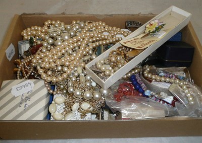 Lot 433 - A box of costume jewellery. including a pair of Trifari earrings, silver jewellery, simulated...