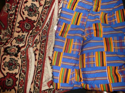 Lot 442 - French reproduction machine woven wall hanging, African patchwork tribal cloth and a rug (3)