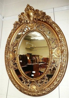 Lot 511 - A modern decorative gilt oval mirror