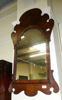 Lot 513 - Walnut fret carved wall mirror