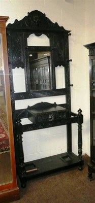 Lot 517 - A late Victorian carved oak and ebonised hall stand