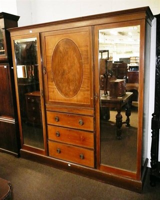 Lot 518 - An Edwardian mahogany triple wardrobe