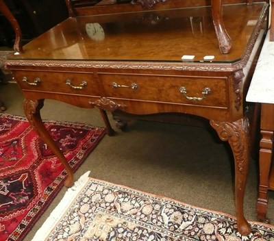 Lot 537 - A reproduction walnut serving table