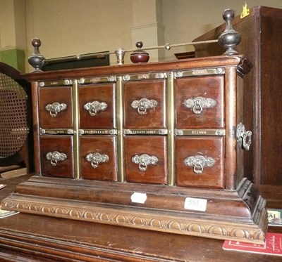 Lot 551 - A brass mounted table cabinet with eight drawers