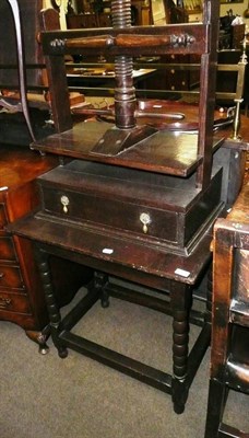 Lot 557 - An early 19th century oak linen press on barley twist legs