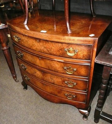 Lot 558 - Reproduction walnut small bow front chest of drawers