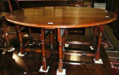 Lot 561 - Reproduction oak and mahogany inlaid drop leaf coffee table