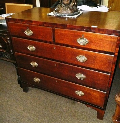 Lot 576 - A Georgian oak four height chest of drawers