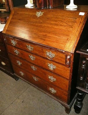 Lot 578 - A Georgian oak bureau