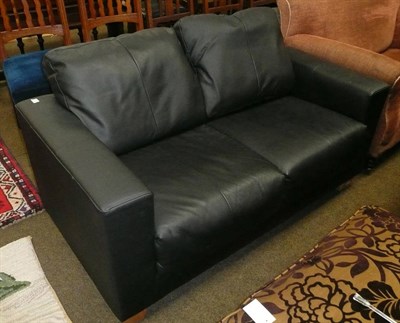 Lot 589 - Modern two seater black leather sofa