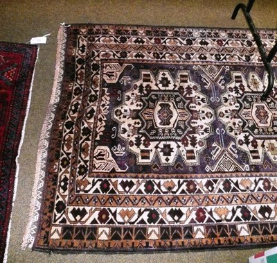 Lot 596 - Baluch rug West Afghanistan, The field with three medallions enclosed by multiple borders 196 x 120