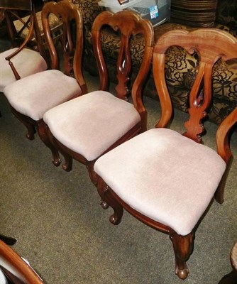 Lot 602 - Three Victorian dining chairs and a mahogany carver chair