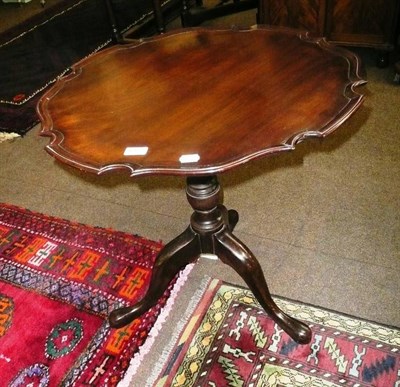 Lot 612 - Georgian mahogany pie crust tripod table