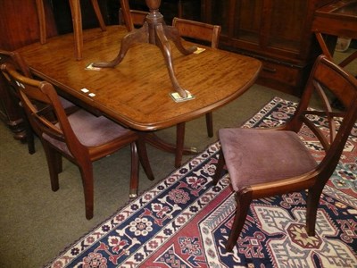 Lot 619 - A modern pedestal extending dining table and six chairs