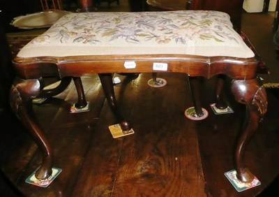 Lot 623 - Walnut shell carved shaped stool with floral woolwork seat cover