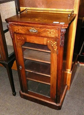 Lot 630 - Walnut inlaid music cabinet