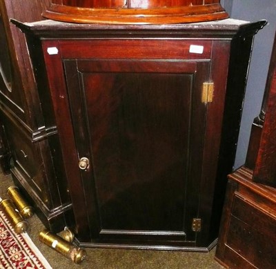 Lot 642 - Georgian mahogany corner cupboard