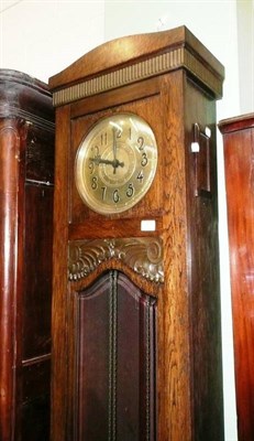 Lot 643 - An oak chiming longcase clock