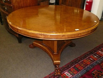 Lot 653 - A reproduction light oak circular breakfast table with burr walnut top