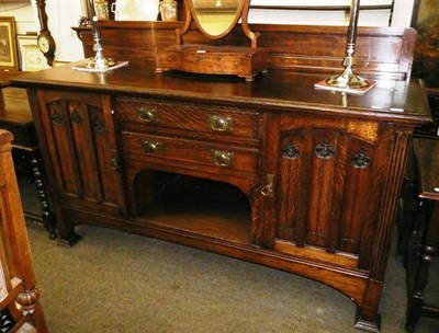 Lot 656 - A large oak sideboard with Arts & Crafts details