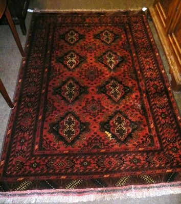 Lot 666 - A rust ground patterned eastern rug