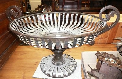 Lot 781 - Steel urn style strapwork planter